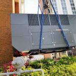 HVAC Unit being lifted to be installed
