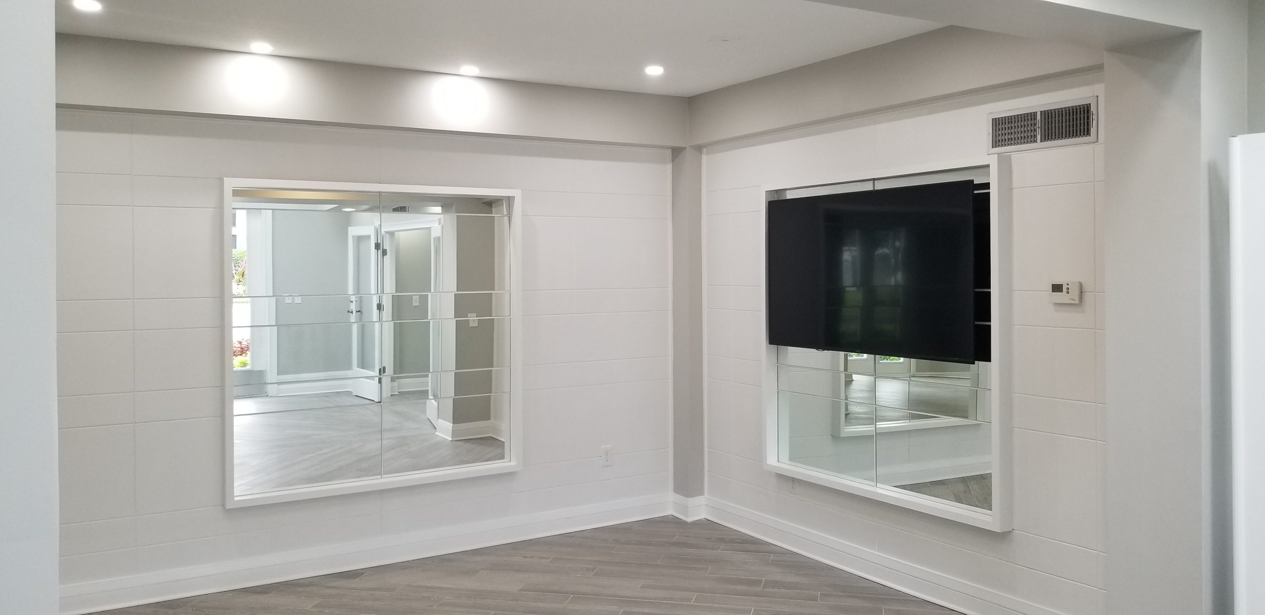 Arbors at Carrollwood Apartments - Wall Design, Mirrors and TV Installation