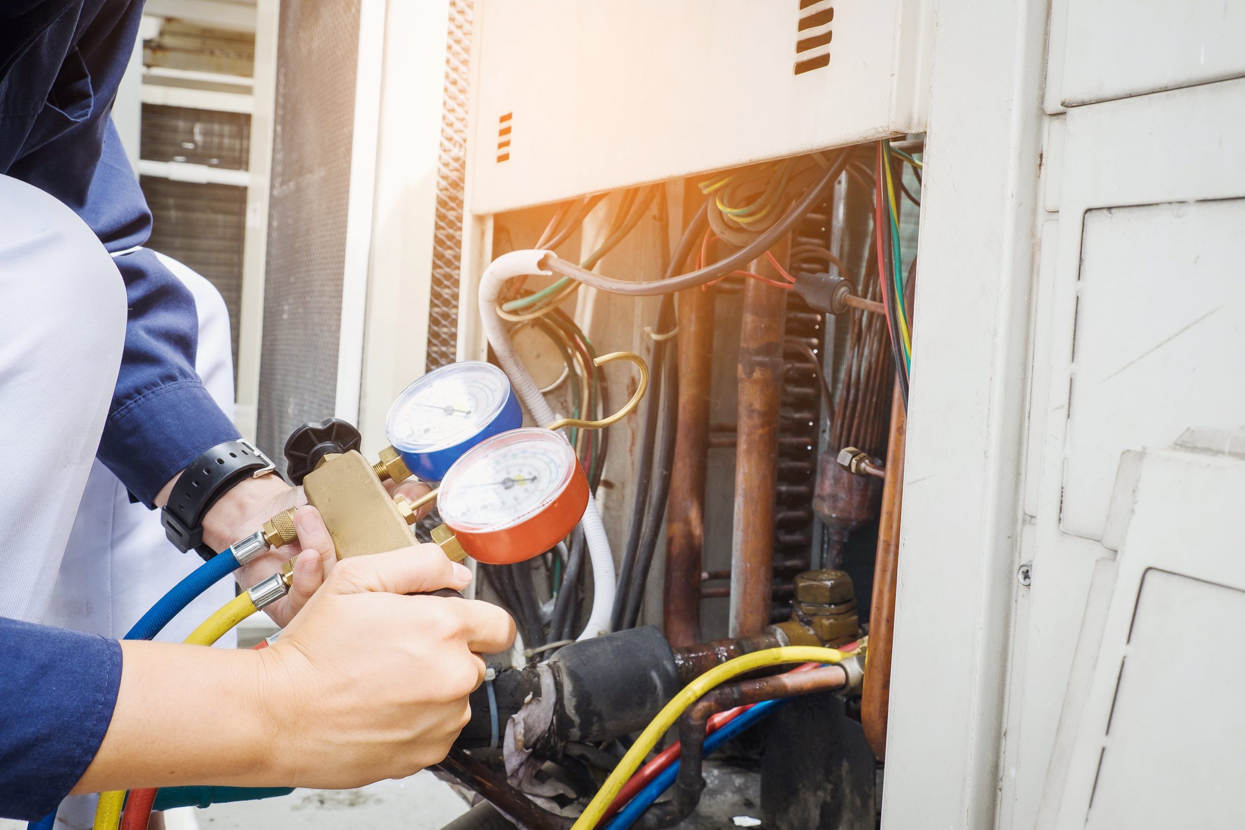 HVAC technician working on a meter