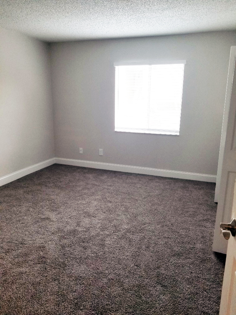 Renovated bedroom with carpet